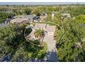 Beautiful aerial view showcases the home's setting amongst lush landscaping in a tranquil neighborhood at 1016 91St Nw St, Bradenton, FL 34209