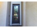 A beautiful glass front door with a decorative design adds elegance to the entryway at 11510 Sweetgrass Dr, Bradenton, FL 34212