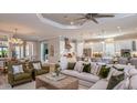 Spacious living room with modern decor, seamlessly connected to a gourmet kitchen at 14907 Contenta Loop, Bradenton, FL 34211