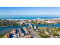 Wide aerial view of the city on the Gulf Coast, beachside condos, and a bridge connecting the islands to the mainland at 1724 Cheyenne St, Sarasota, FL 34231
