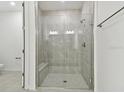 Contemporary bathroom features a glass shower with gray tile and a built-in bench at 18016 Cherished Loop, Bradenton, FL 34211