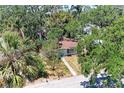 Charming single-story home nestled among mature trees, providing shade and privacy at 209 29Th Nw St, Bradenton, FL 34205