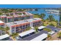 Waterfront condos with parking lot, boat docks, and lush landscaping at 210 Santa Maria St # 244, Venice, FL 34285