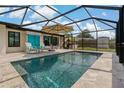 Inviting screened-in pool area featuring stylish patio furniture and a sparkling swimming pool at 2708 Fort Worth St, Sarasota, FL 34231