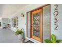 Up close view of front door featuring wrought iron and glass accent at 2932 Upper Tangelo Dr, Sarasota, FL 34239