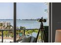 Amazing view of the bay from the apartment's window, featuring clear skies, calm water, and distant cityscape at 301 Quay Commons # 611, Sarasota, FL 34236