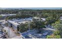 Aerial view of Oasis on Osprey community with mature trees and bay views at 3350 S Osprey Ave # 211A, Sarasota, FL 34239