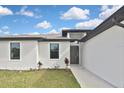 Close up of the home's front exterior showing the main entrance at 3836 Wenona Dr, North Port, FL 34288