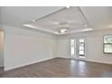 Open-concept living area with wood floors and recessed lighting at 3836 Wenona Dr, North Port, FL 34288