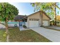 Charming home features a well-manicured lawn and an attached single-car garage at 428 40Th W Ct, Palmetto, FL 34221