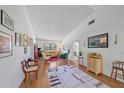 Bright and airy living room featuring wood floors, decorative art, and large window views at 6040 Oak Creek Ln # 1822, Bradenton, FL 34210