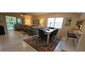 Cozy living and dining area with tile floors and comfortable seating at 7858 Eagle Creek Dr # 7442, Sarasota, FL 34243