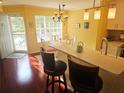 Cozy dining area with counter seating and view to the front door and outdoor light at 850 S Tamiami Trl # 529, Sarasota, FL 34236