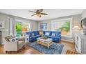 Cozy living room with comfortable seating, hardwood floors, and abundant natural light at 113 8Th S St, Bradenton Beach, FL 34217