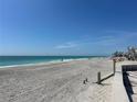 Expansive beach with clear turquoise ocean and blue sky at 1190 Shore View Dr # C, Englewood, FL 34223
