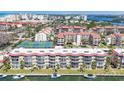 Waterfront condos with balconies and boat slips offer picturesque views, tennis courts, and serene landscaping at 1250 N Portofino Dr # 304, Sarasota, FL 34242