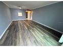 Sunlit living room with hardwood floors and neutral tones at 2700 Coconut Bay Ln # 432, Sarasota, FL 34237
