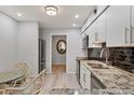 Modern kitchen boasts stainless steel appliances, granite countertops, and sleek cabinetry at 4169 66Th Street W Cir # 4169, Bradenton, FL 34209