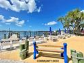 Beautiful community dock with ample seating, picnic tables, and stunning waterfront views, perfect for relaxation and socializing at 4408 125Th W St, Cortez, FL 34215