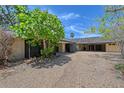 Spacious driveway leading to a unique home design with ample parking at 5502 Shadow Lawn Dr, Sarasota, FL 34242