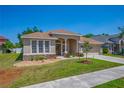 Inviting single-story home with a nicely landscaped front yard and neutral color palette at 6106 34Th E Ct, Ellenton, FL 34222