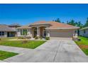 A charming residence featuring a two-car garage and a well-maintained lawn, exemplifying suburban living at 6106 34Th E Ct, Ellenton, FL 34222