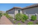 Side view of well maintained property with landscaped garden and seamless design at 6120 Plateau Ct, Bradenton, FL 34203
