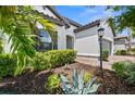 Detailed landscaping enhances the front yard of this inviting single-Gathering home at 6266 Mesa Gln, Bradenton, FL 34203