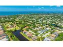 Beautiful aerial view showing waterfront home with a private pool and serene surrounding community at 9226 13Th Avenue Nw Cir, Bradenton, FL 34209
