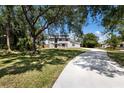 Beautiful two-story home with a spacious front yard and a long driveway, perfect for a Gathering at 10712 Forest Run Dr, Bradenton, FL 34211