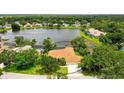 Beautiful lakefront home with a screened-in pool and mature landscaping at 11215 Rivers Bluff Cir, Lakewood Ranch, FL 34202