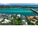 Scenic aerial view of luxurious waterfront homes along the turquoise water at 1435 Westway Dr, Sarasota, FL 34236