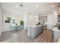 Open concept kitchen and dining area with modern finishes and plenty of natural light at 160 Eagleston Ln, Lakewood Ranch, FL 34240