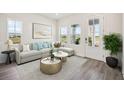 Bright living room with stylish furniture, neutral tones, and lots of natural light at 160 Eagleston Ln, Lakewood Ranch, FL 34240