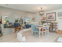 Inviting dining room with vaulted ceilings, a modern chandelier, and seamless transition to living spaces at 3609 57Th Avenue W Dr # 37, Bradenton, FL 34210