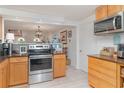 Updated kitchen featuring stainless steel appliances, modern countertops, and an efficient layout for cooking at 3609 57Th Avenue W Dr # 37, Bradenton, FL 34210
