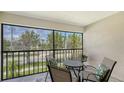 Screened patio with outdoor seating, perfect for enjoying the view at 525 Barcelona Ave # 207, Venice, FL 34285