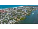 Gorgeous aerial view of waterfront condos nestled near pristine beaches, providing a tranquil and desirable location at 6157 Midnight Pass Rd # B42, Sarasota, FL 34242