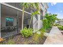 Screened lanai featuring patio furniture, neutral paint, and access to stairs and walkway at 14184 Heritage Landing Blvd # 513, Punta Gorda, FL 33955