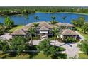 Luxury estate with beautiful landscaping, paver driveway and lake view at 18826 Ganton Ave, Lakewood Ranch, FL 34202