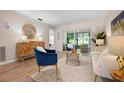 Bright living area featuring neutral walls, modern furniture, and sliding glass doors at 3360 Tallywood Ct # 7082, Sarasota, FL 34237