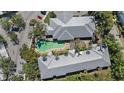 Overhead view showcasing a community pool, well-maintained landscaping, and gray roofing at 3405 54Th W Dr # 102, Bradenton, FL 34210