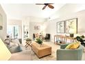 Bright living room with vaulted ceilings, tile flooring, and comfortable seating at 3449 Yonge Ave, Sarasota, FL 34235
