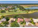 Beautiful single-story home boasts water and golf course views from the backyard at 407 Fieldstone Dr, Venice, FL 34292