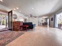 Open floor plan featuring a spacious living room, dining area, and views to the outdoor garden at 4576 Cooper Rd, Sarasota, FL 34232