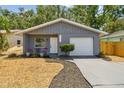 Charming single-story home with a freshly painted exterior and a well-maintained front yard, perfect for curb appeal at 4741 Watkins Ave, Sarasota, FL 34233
