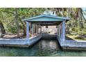 Covered boathouse for easy water access and boat storage, perfect for waterfront living and boating enthusiasts at 5033 Oxford Dr, Sarasota, FL 34242