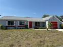 Well-maintained single-Gathering home with colorful accents, tidy lawn, and an attached one-car garage at 5315 Malamin Rd, North Port, FL 34287
