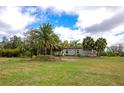 Charming single-story home with mature landscaping and a spacious front yard at 6321 279Th E St, Myakka City, FL 34251