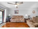 Inviting living room with hardwood floors, a comfortable sofa, and stylish decor creates a warm ambiance at 7203 Curtiss Ave # 3D, Sarasota, FL 34231